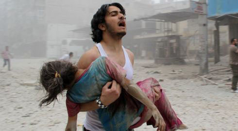 A man carrying a wounded young child