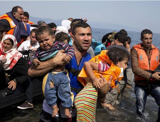 A man carrying his children in the water