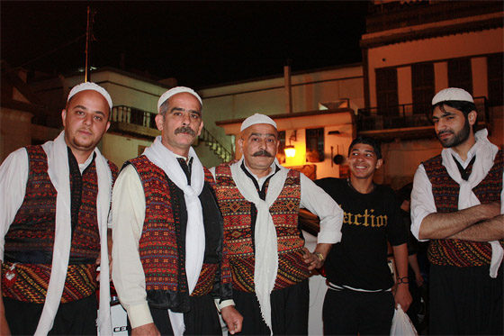 A group of Syrian men dressed in traditional clothing