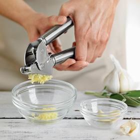 the Garlic Press being used to cut garlic